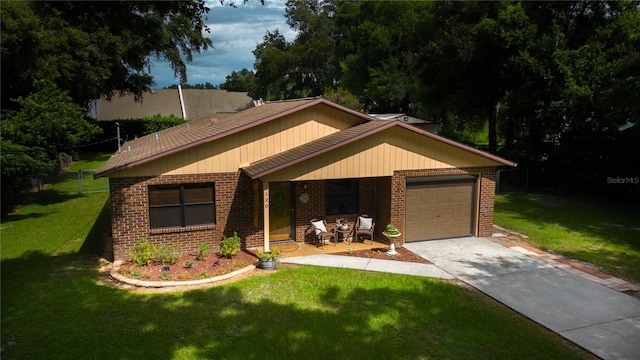 view of front facade with a garage and a front yard