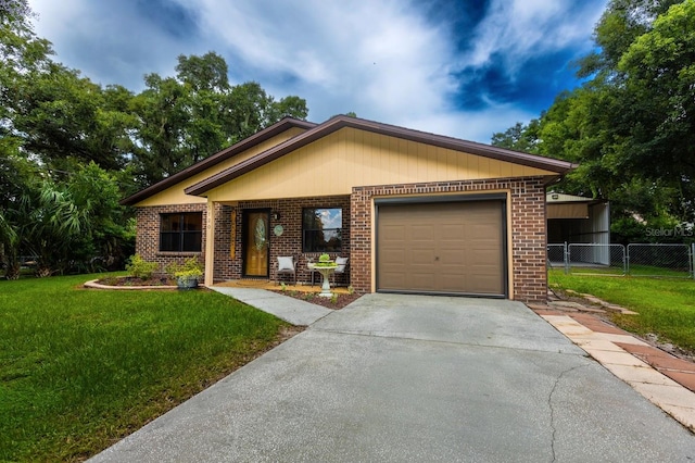 single story home with a front yard and a garage