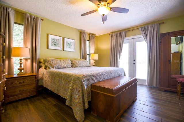 bedroom with multiple windows, ceiling fan, and dark hardwood / wood-style floors