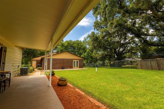 view of yard featuring central AC and a patio area