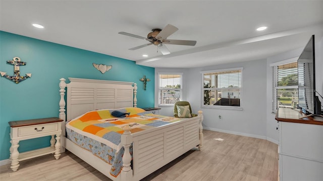 bedroom featuring ceiling fan and light hardwood / wood-style floors