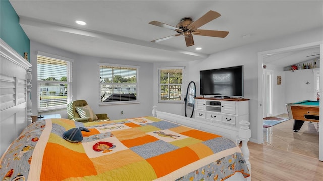 bedroom featuring ceiling fan, pool table, and light hardwood / wood-style floors