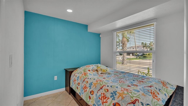 bedroom with light tile patterned flooring