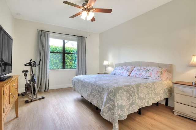 bedroom with light wood-type flooring and ceiling fan