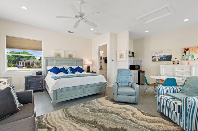 bedroom with ceiling fan and ensuite bath