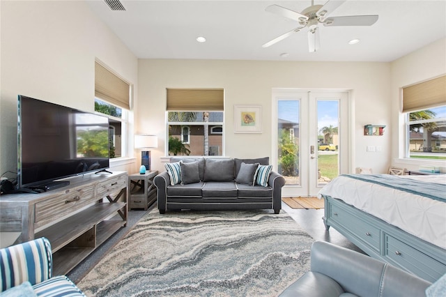 interior space with french doors, wood-type flooring, access to outside, and ceiling fan