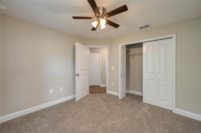 unfurnished bedroom featuring ceiling fan, carpet floors, and a closet