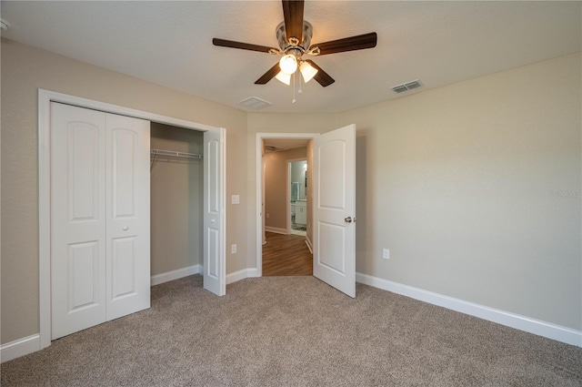 unfurnished bedroom featuring a closet, ceiling fan, and carpet flooring