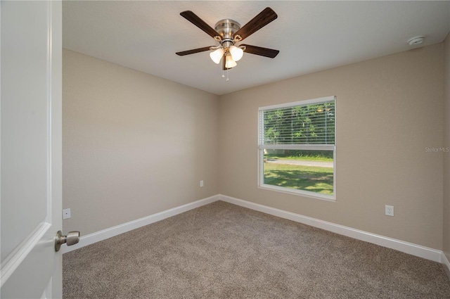 spare room featuring carpet flooring and ceiling fan