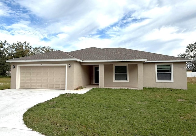 view of front of property featuring a garage and a front yard