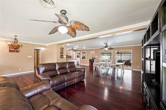 living room with ceiling fan with notable chandelier, dark hardwood / wood-style flooring, and crown molding