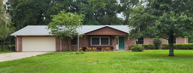 ranch-style home with a front lawn and a garage