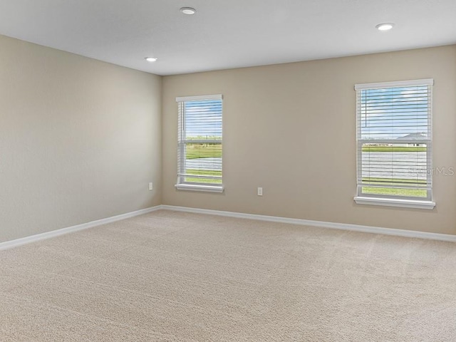 empty room with carpet flooring