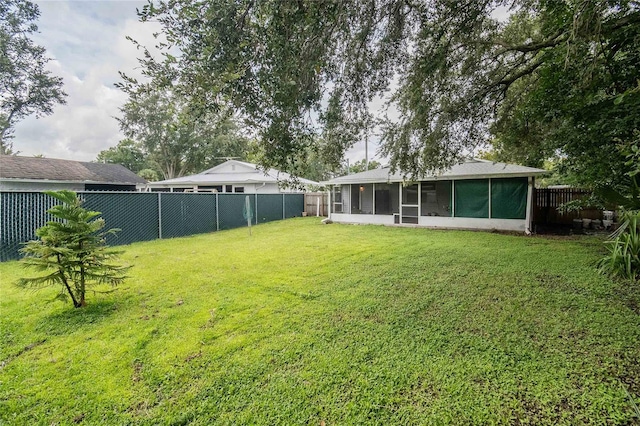 view of yard with a sunroom