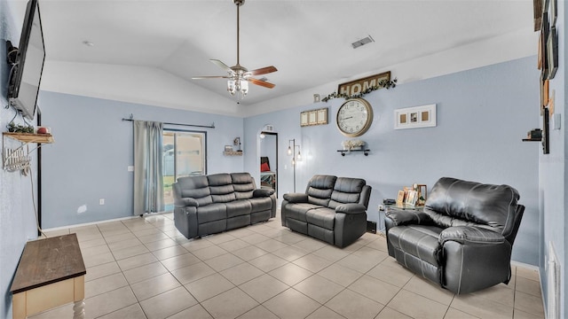 living area featuring lofted ceiling, light tile patterned floors, visible vents, and ceiling fan