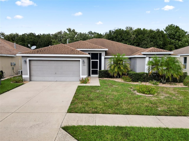 ranch-style house with a front lawn and a garage