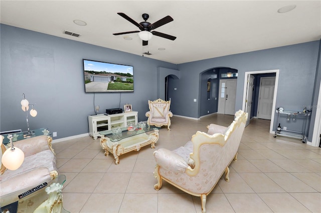 living room with ceiling fan and light tile patterned floors