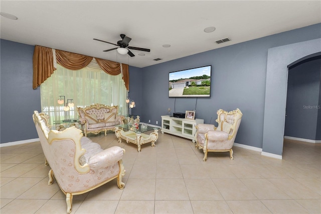 tiled living room featuring ceiling fan