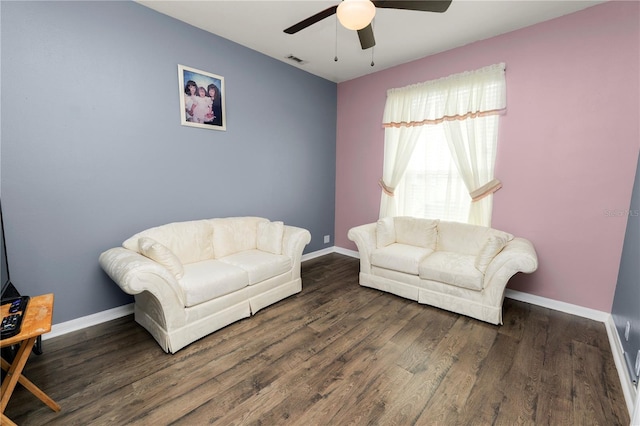 interior space featuring ceiling fan and dark hardwood / wood-style floors