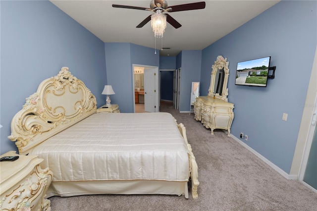 carpeted bedroom featuring ceiling fan and connected bathroom