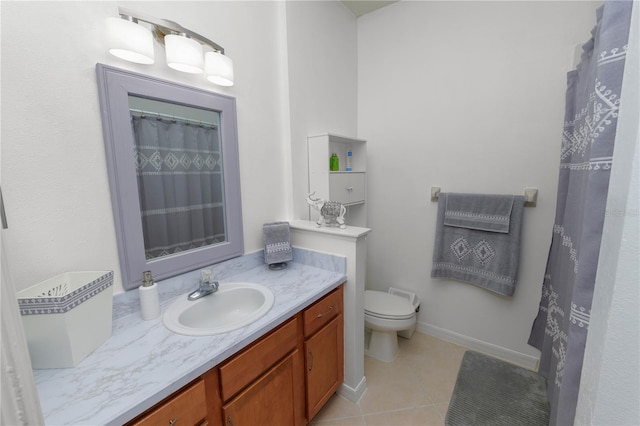 bathroom featuring vanity, toilet, and tile patterned floors