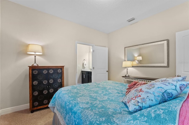 bedroom featuring light colored carpet, connected bathroom, visible vents, and baseboards