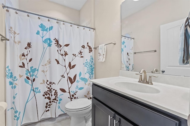 full bathroom featuring toilet, tile patterned flooring, and vanity