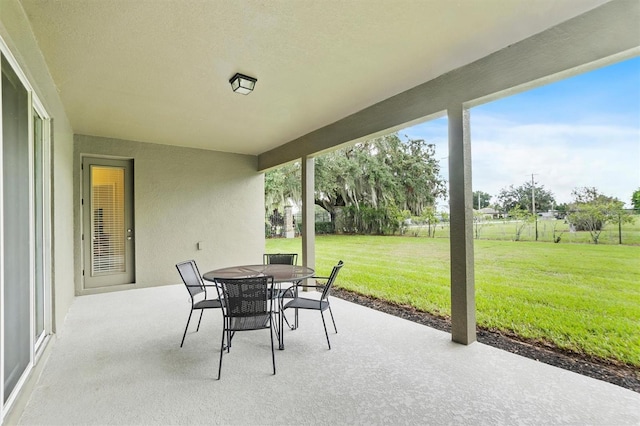 view of patio / terrace featuring outdoor dining space and fence