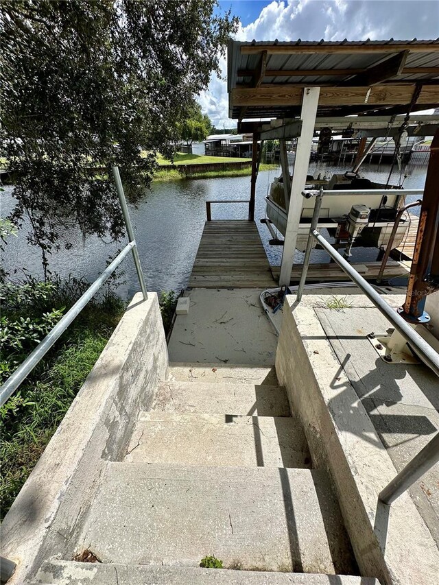 dock area featuring a water view