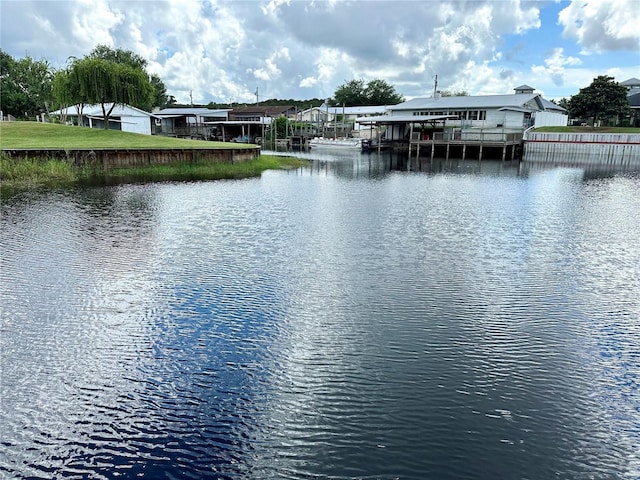 property view of water featuring a dock