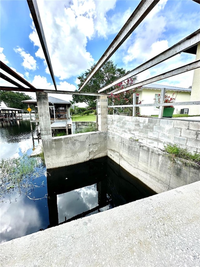 exterior space with a water view