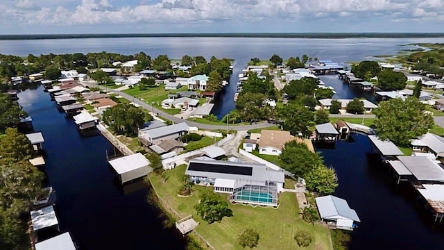 bird's eye view featuring a water view and a residential view