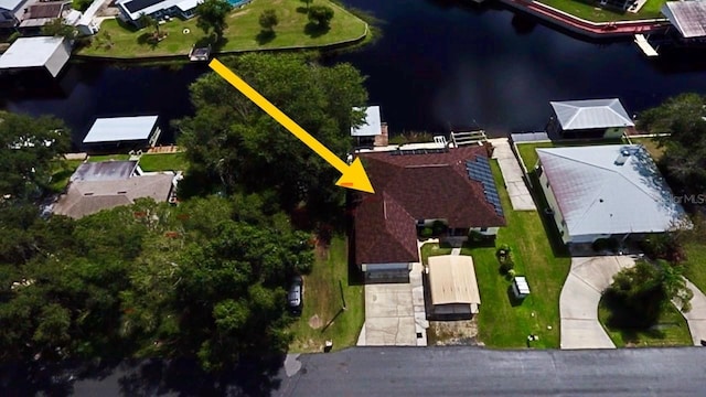 birds eye view of property featuring a water view and a residential view