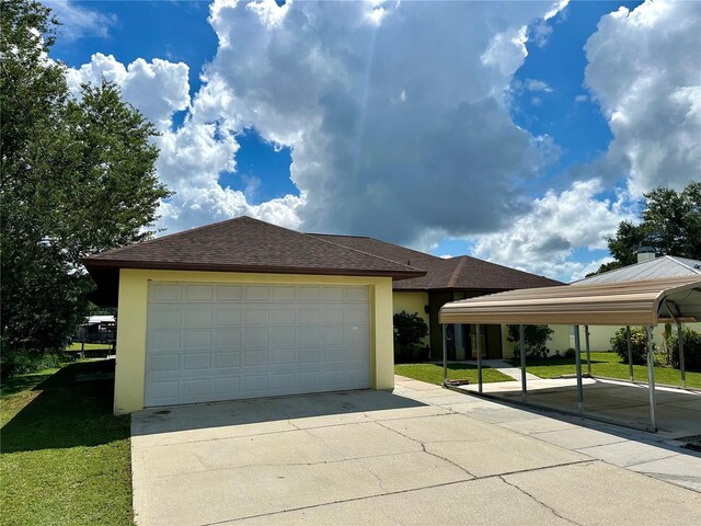 view of front of property with a carport and a front yard