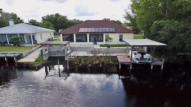 view of dock with a water view and boat lift