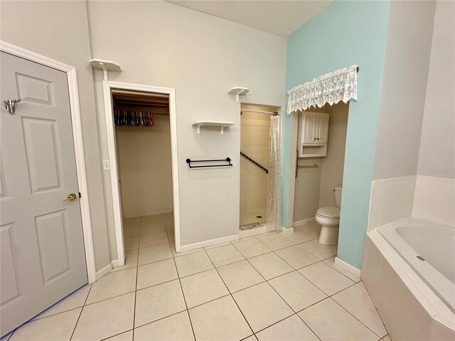 full bath with tile patterned floors, toilet, a bath, and a shower stall