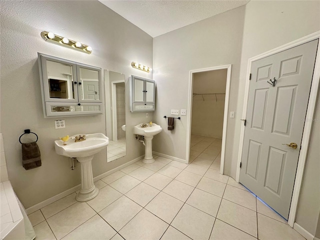 bathroom with tile patterned flooring and sink