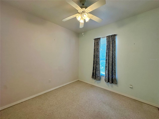 unfurnished room with ceiling fan, carpet, and baseboards