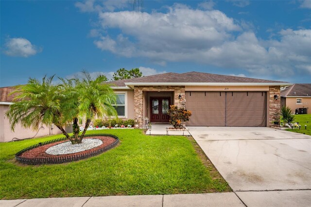 view of front facade with french doors and a front lawn