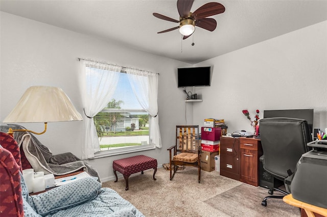 office area with light carpet, baseboards, and ceiling fan