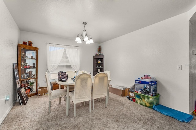 dining space with baseboards, carpet floors, and an inviting chandelier