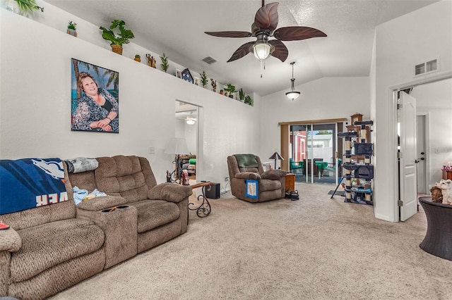 living room featuring carpet, ceiling fan, and lofted ceiling