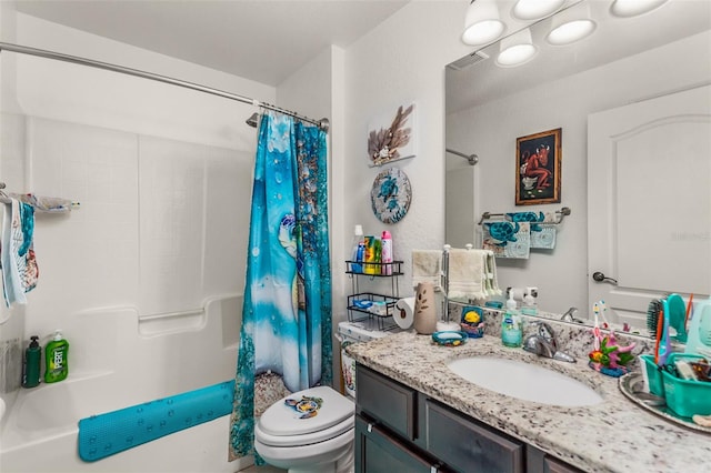 full bathroom with shower / bath combo with shower curtain, vanity, and toilet