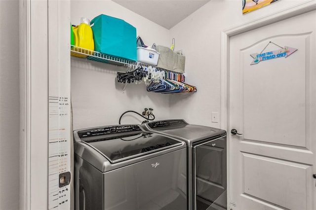 washroom with separate washer and dryer