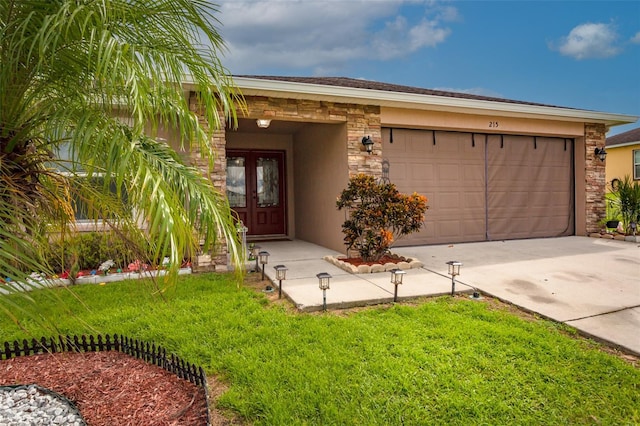 view of front facade featuring a garage and a front lawn