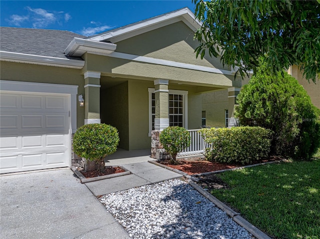 property entrance with a garage and a porch