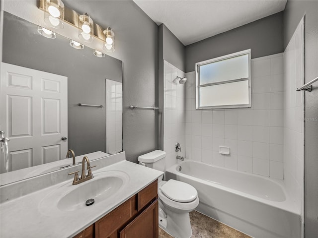 full bathroom featuring toilet, vanity, and tiled shower / bath