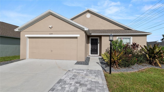 view of front of property with a garage