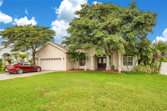 view of front of house with a garage and a front lawn