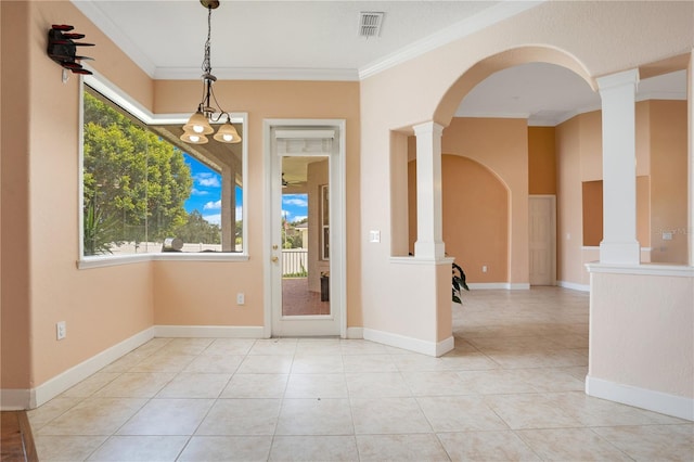 unfurnished room featuring crown molding, ornate columns, and light tile patterned floors